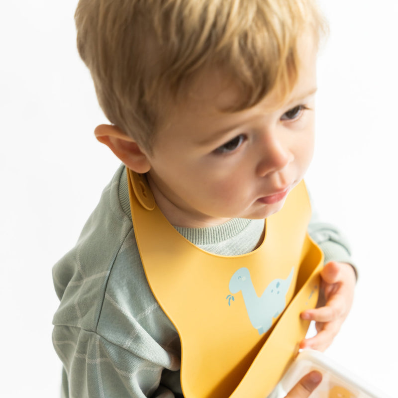 Babero de silicona "Party" - Dino Mostaza